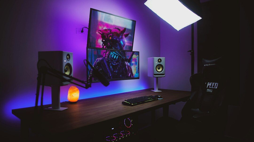 Video editor sitting at a desk with multiple monitors showing a timeline
